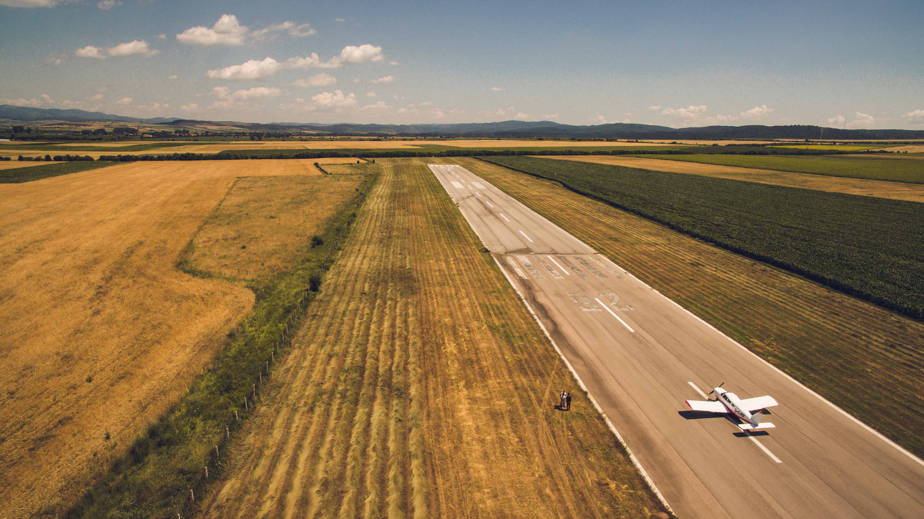 runway surrounded by wheat field