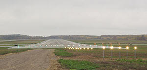 runway with lights at dusk