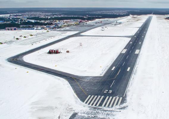 Aerial photo of runway surrounded by snow