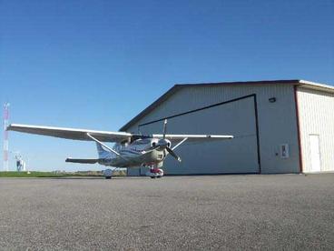 Hangar and plane at county airport